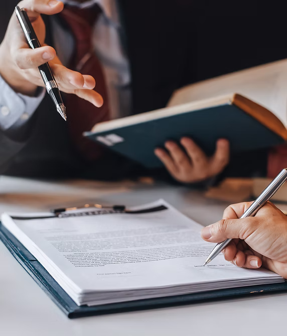 Person signing a legal document