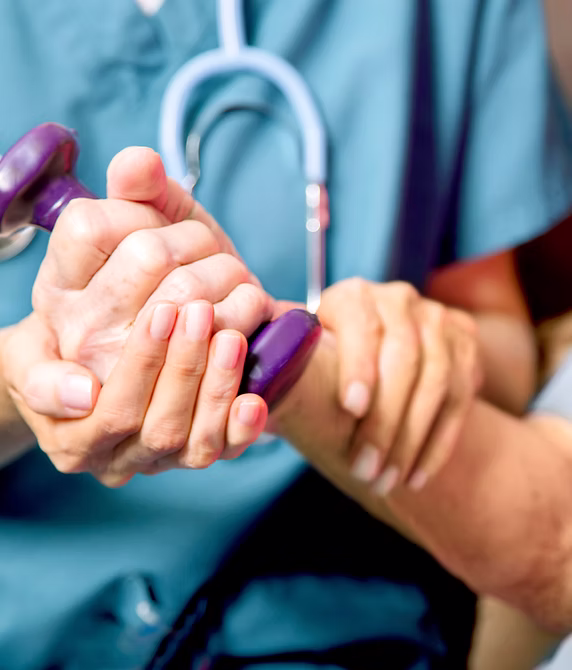 Healthcare worker checking a patient's pulse